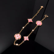 STAR AND SUN 4 MOTIF PINK MOP PINK GOLD BRACELET