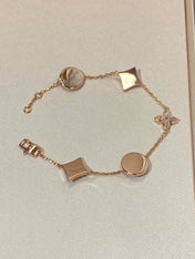 STAR AND SUN 5 MOTIF MOP PINK GOLD BRACELET