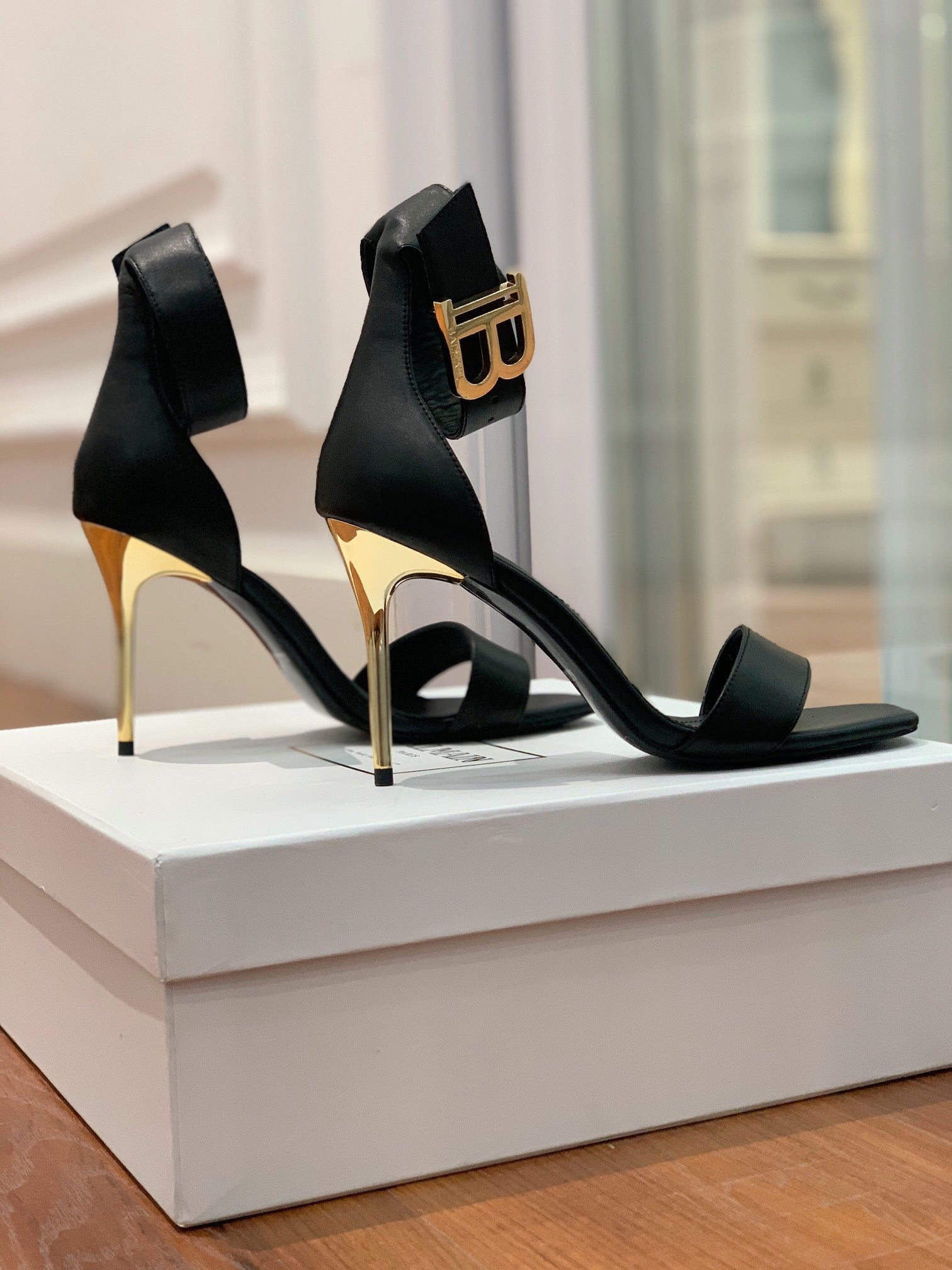 BALMAIN 25S THIN STRAP HIGH HEELS 105MM IN BLACK CALFSKIN GOLD HARDWARE