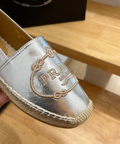 PRADA 26S EMBROIDERED LOGO ESPADRILLE FLATS IN SILVER CALFSKIN
