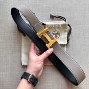 HM BELT BUCKLE & REVERSIBLE BLACK AND TAN BROWN LEATHER STRAP 38MM GOLD HARDWARE