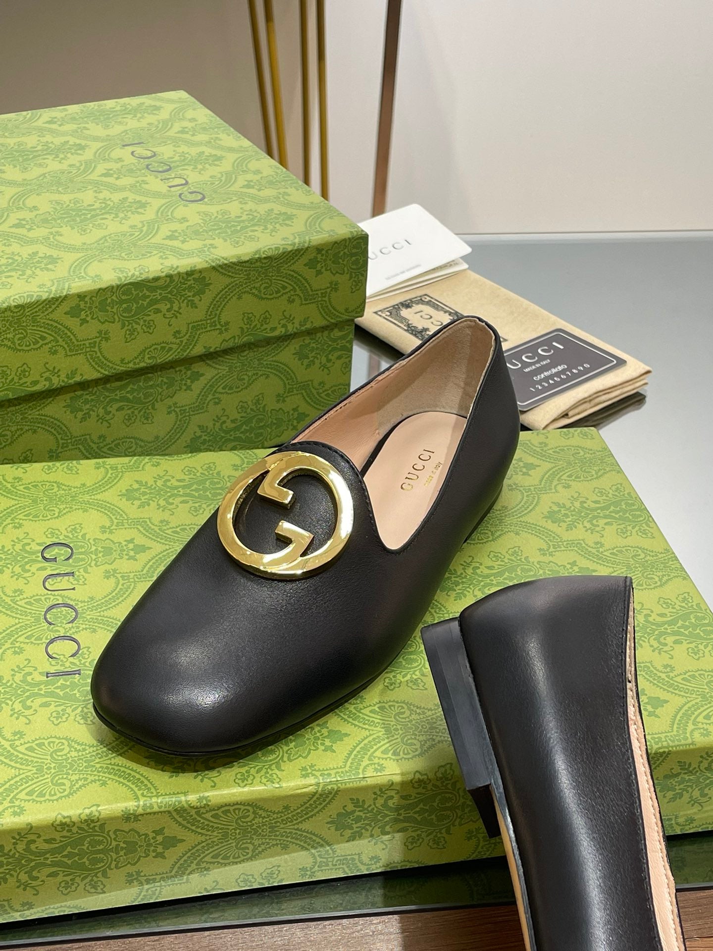 BLONDIE LOGO-PLAQUE LOAFERS IN BLACK CALFSKIN WITH GOLD HARDWARE