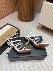 ALAIA THREE-STRAPS HIGH HEEL SANDALS IN WHITE PATENT LAMBSKIN