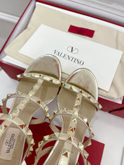 ROCKSTUD 100 GOLD METALLIC CALFSKIN ANKLE STRAP HIGH SANDAL
