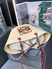 MEDIUM ANAGRAM BASKET BAG 46 IN BEIGE IRACA PALM AND TAN CALFSKIN