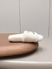 CHANEL 26S SLIDE MULES IN WHITE SHEARLING AND BLACK CC LOGO