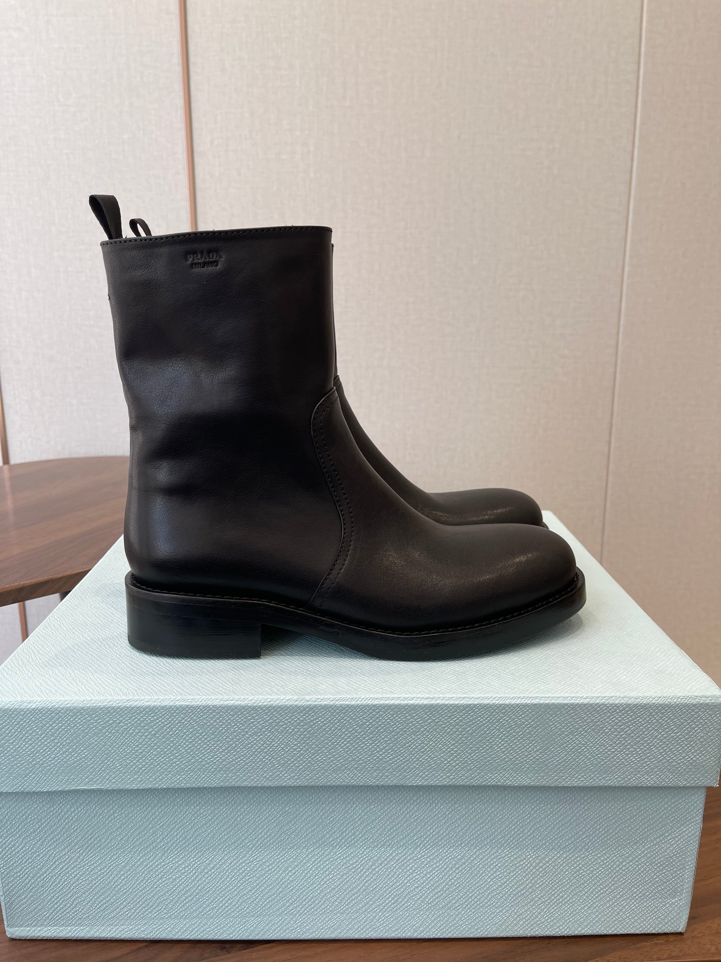 PRADA 25S COWBOY BOOTS IN DARK BLACK-BROWN CALFSKIN