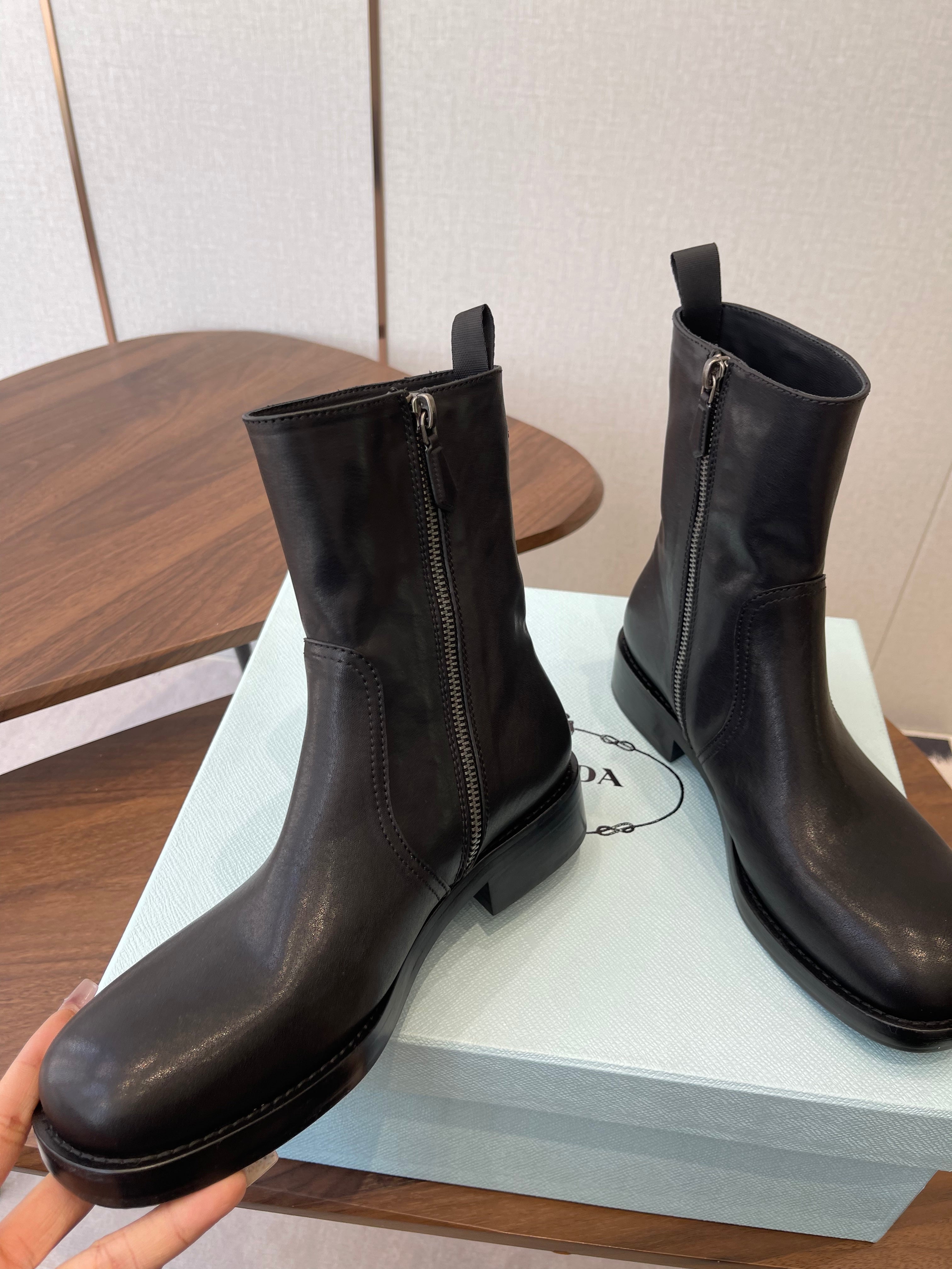 PRADA 25S COWBOY BOOTS IN DARK BLACK-BROWN CALFSKIN