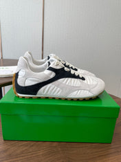 BOTTEGA VENETA 26S ORBIT FLASH SNEAKERS IN WHITE AND BLACK SUEDE