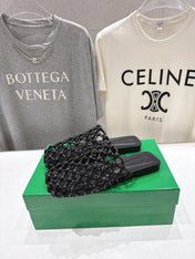 BOTTEGA VENETA 26S WOVEN MULES IN BLACK LAMBSKIN
