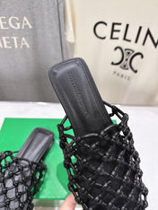 BOTTEGA VENETA 26S WOVEN MULES IN BLACK LAMBSKIN