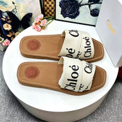CHLOE 26S CRISSCROSS SLIDES IN BEIGE CANVAS