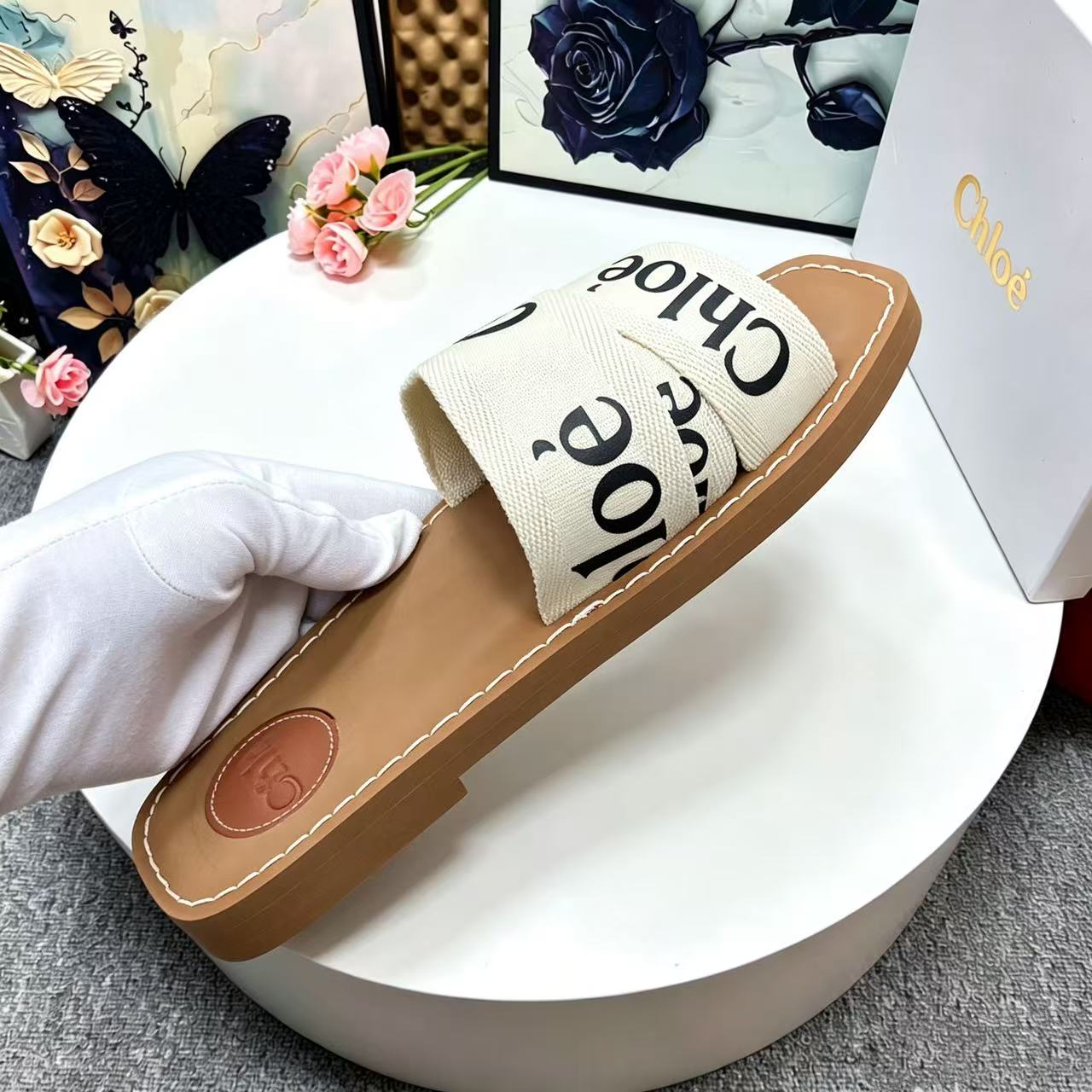CHLOE 26S CRISSCROSS SLIDES IN BEIGE CANVAS