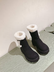 ANKLE BOOTS IN BLACK EMBOSSED CALFSKIN AND WHITE SHEARLING