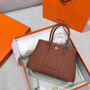 GARDEN PARTY 23CM IN UMBER BROWN CALFSKIN