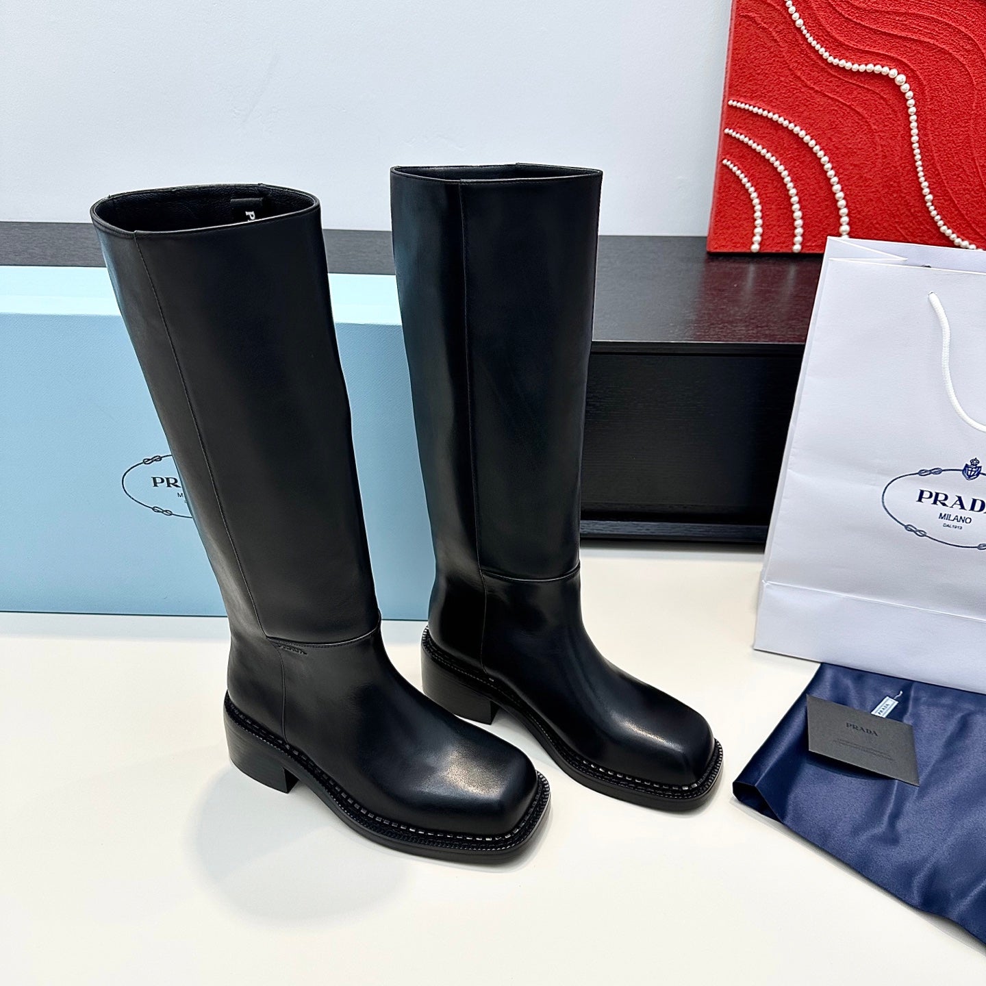 PRADA 25S SQUARE-TOE HIGH-CUT BOOTS IN BLACK CALFSKIN