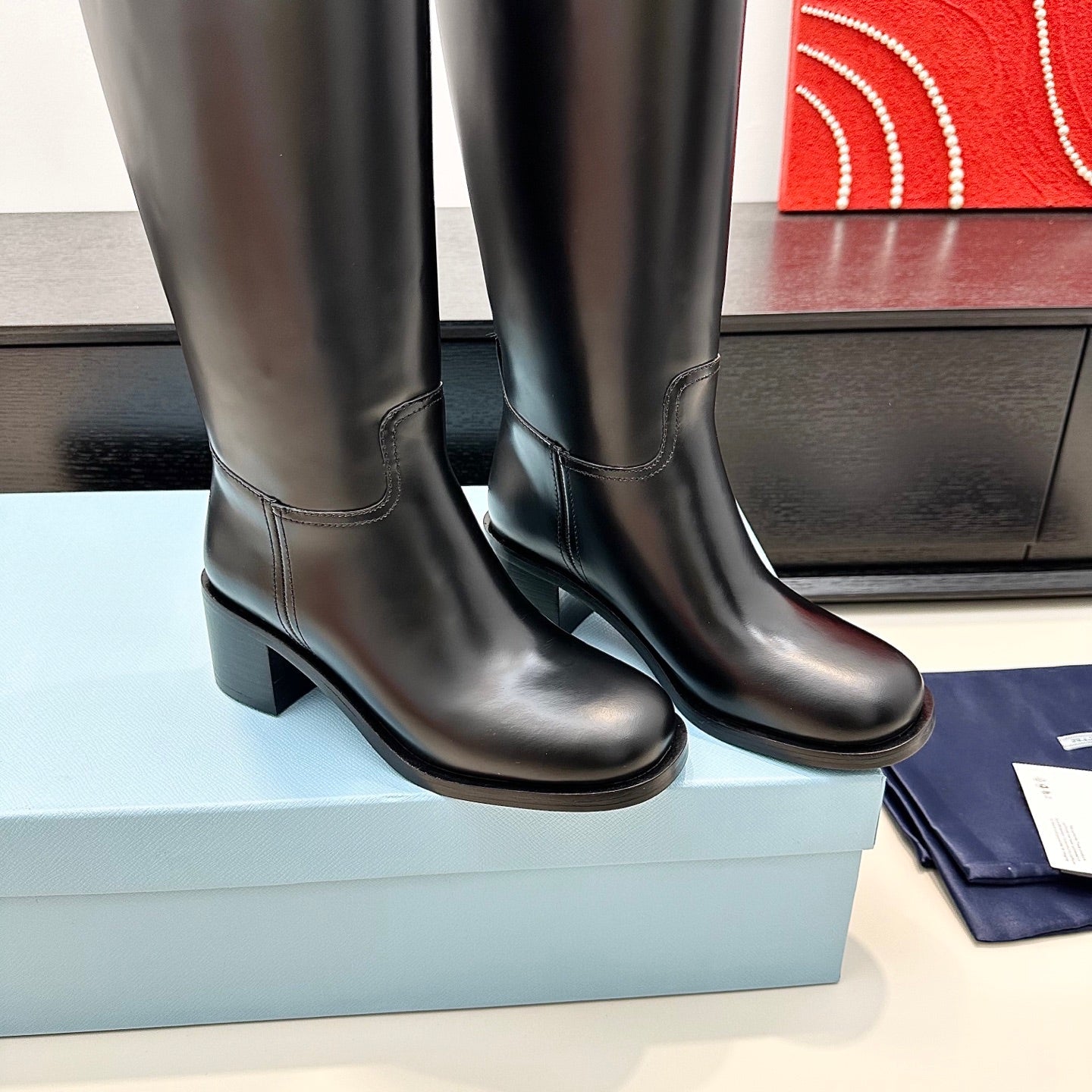 PRADA 25S HIGH-CUT BOOTS 55 MM IN BLACK CALFSKIN