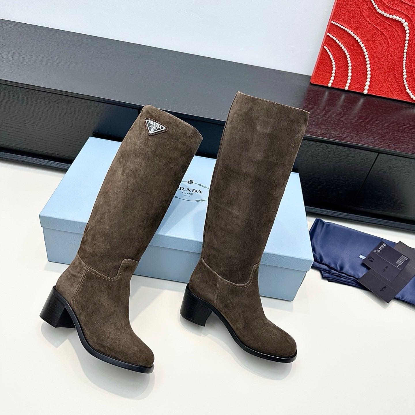 PRADA 25S HIGH-CUT BOOTS 55 MM IN EARTH BROWN SUEDE