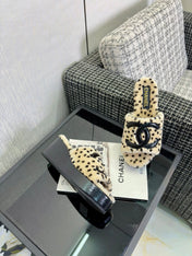 CHANEL 26S PLATFORM SLIDE SANDALS IN BEIGE SHEARLING AND BLACK CC LOGO SQUARE TOE