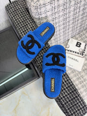 CHANEL 26S SLIDE SANDALS IN BLACK AND BLUE SHEARLING OPEN TOE