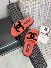 CHANEL 26S SLIDE SANDALS IN BLACK AND CORAL PINK SHEARLING OPEN TOE