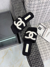CHANEL 26S SLIDE SANDALS IN BLACK SHEARLING AND WHITE CC LOGO SQUARE TOE