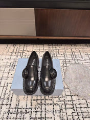 PRADA 26S BUCKLED LOAFERS IN BLACK SHINY CALFSKIN