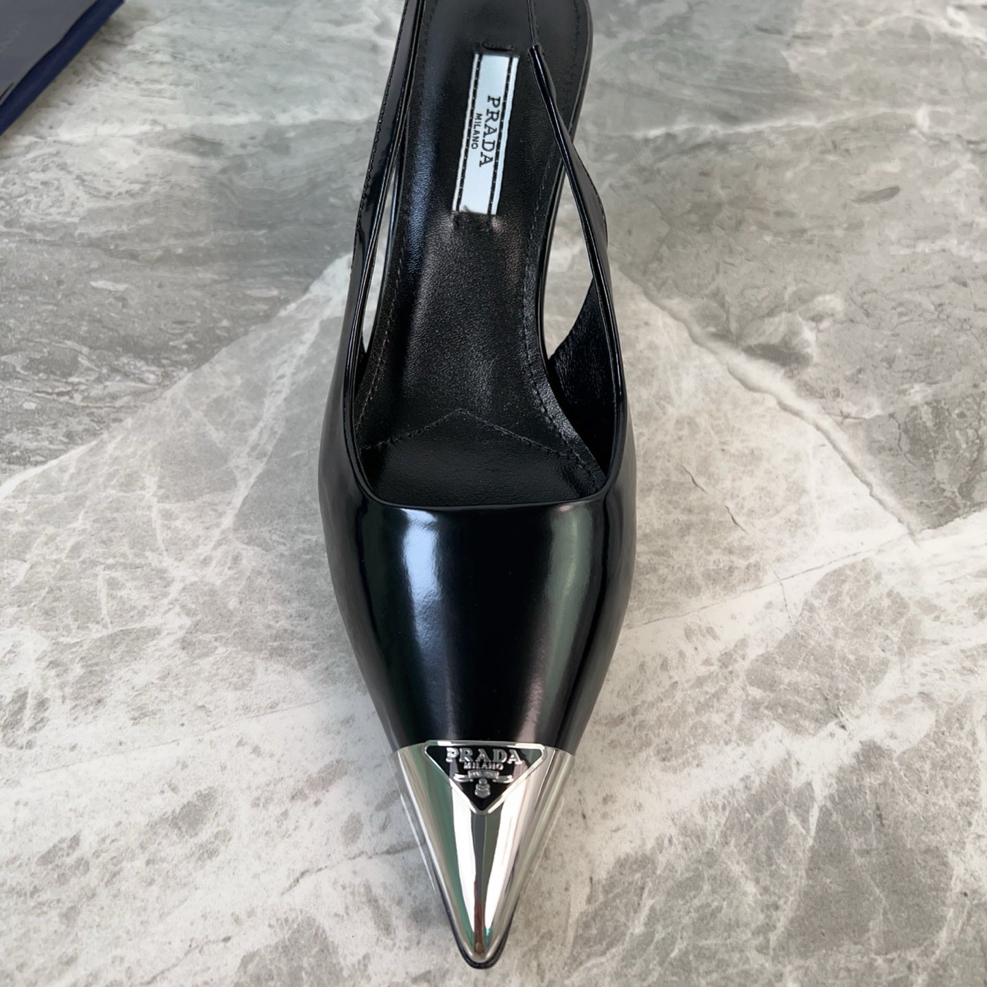 PRADA 25S METAL-TOE SLINGBACK PUMPS IN BLACK CALFSKIN