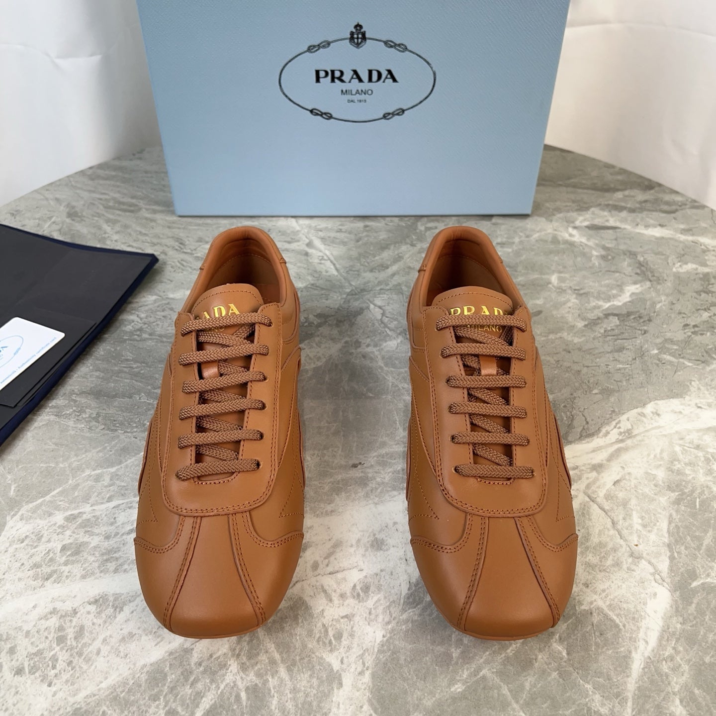 PRADA 25S MONTECARLO ANTIQUED SNEAKERS IN CARAMEL NAPPA LEATHER