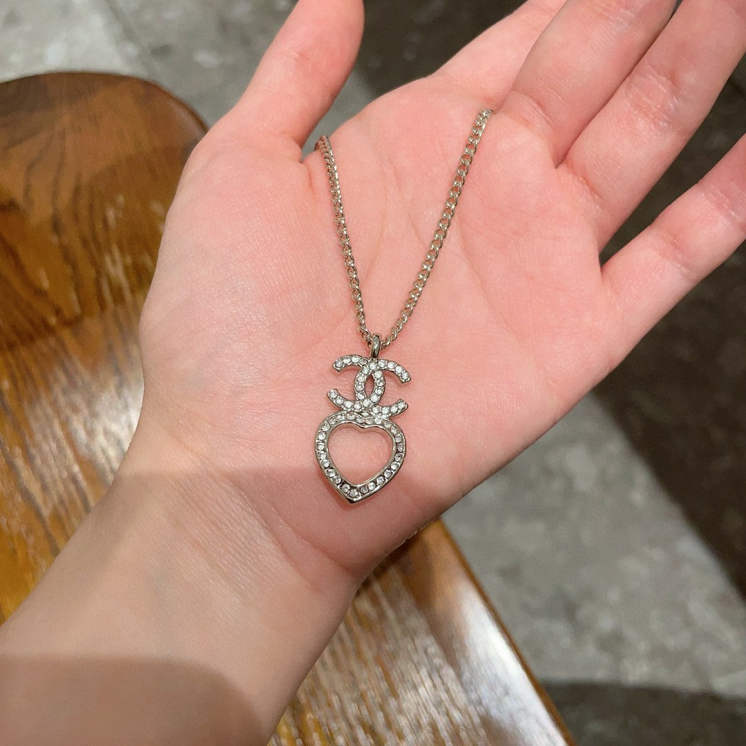 DOUBLE C HEART NECKLACE WITH CRYSTALS WHITE PEARLS AND SILVER METAL
