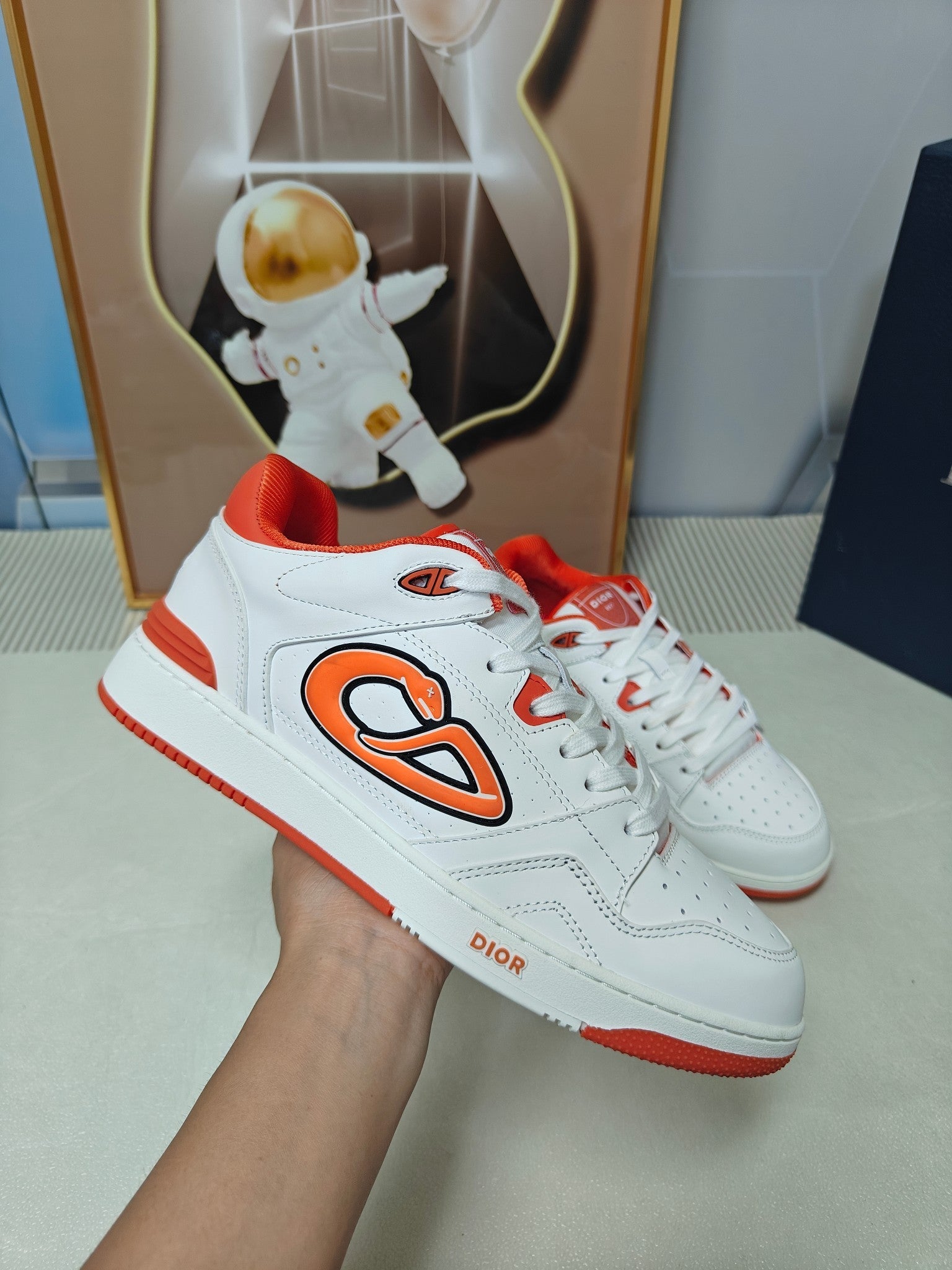 DIOR 26S LOW-TOP SNEAKER IN WHITE AND ORANGE CALFSKIN