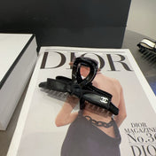 CHANEL 26S BOW HAIR CLIP IN BLACK ACETATE 512098