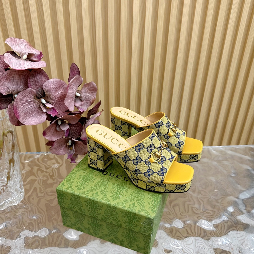 HORSEBIT SLIDE SANDAL IN TUSCANY YELLOW MONOGRAM CANVAS AND SHEEPSKIN LINING