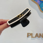CHANEL 26S BARRETTE HAIR CLIP IN BLACK AND IVORY LEATHER 505338