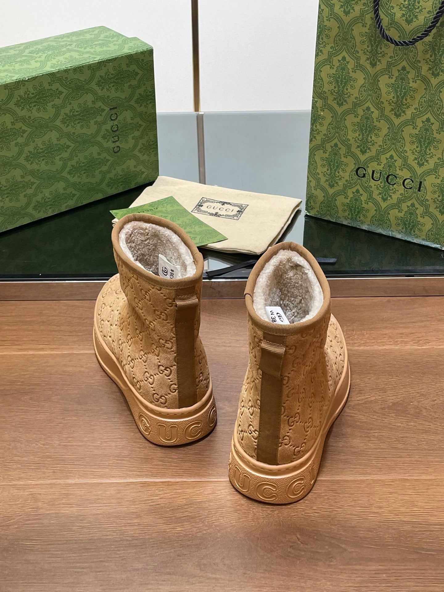 GG UGG BOOTS IN CIDER BROWN EMBOSSED SUEDE AND BEIGE WOOL LINING