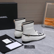 CHANEL 26S ANKLE BOOTS IN WHITE CALFSKIN WITH BLACK PATENT LEATHER TRIM AND CC LOGO ON TOE CAP