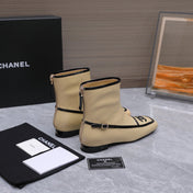 CHANEL 26S ANKLE BOOTS IN BEIGE CALFSKIN WITH BLACK PATENT LEATHER TRIM AND CC LOGO ON TOE CAP