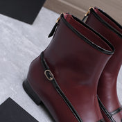 CHANEL 26S ANKLE BOOTS IN BURGUNDY CALFSKIN WITH BLACK PATENT LEATHER TRIM AND CC LOGO ON TOE CAP