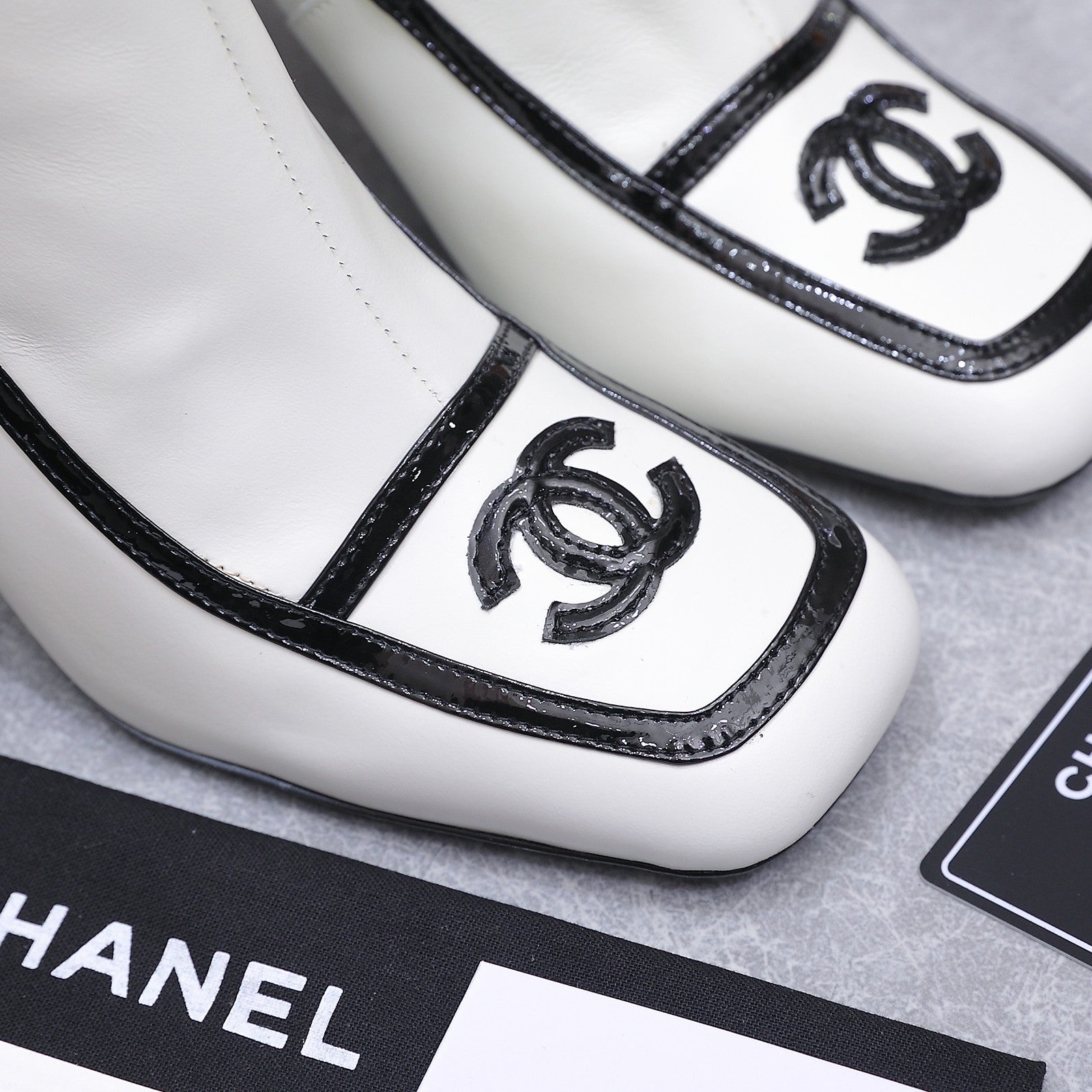 CHANEL 26S ANKLE BOOTS 80 MM IN WHITE CALFSKIN WITH BLACK PATENT LEATHER TRIM AND CC LOGO ON TOE CAP
