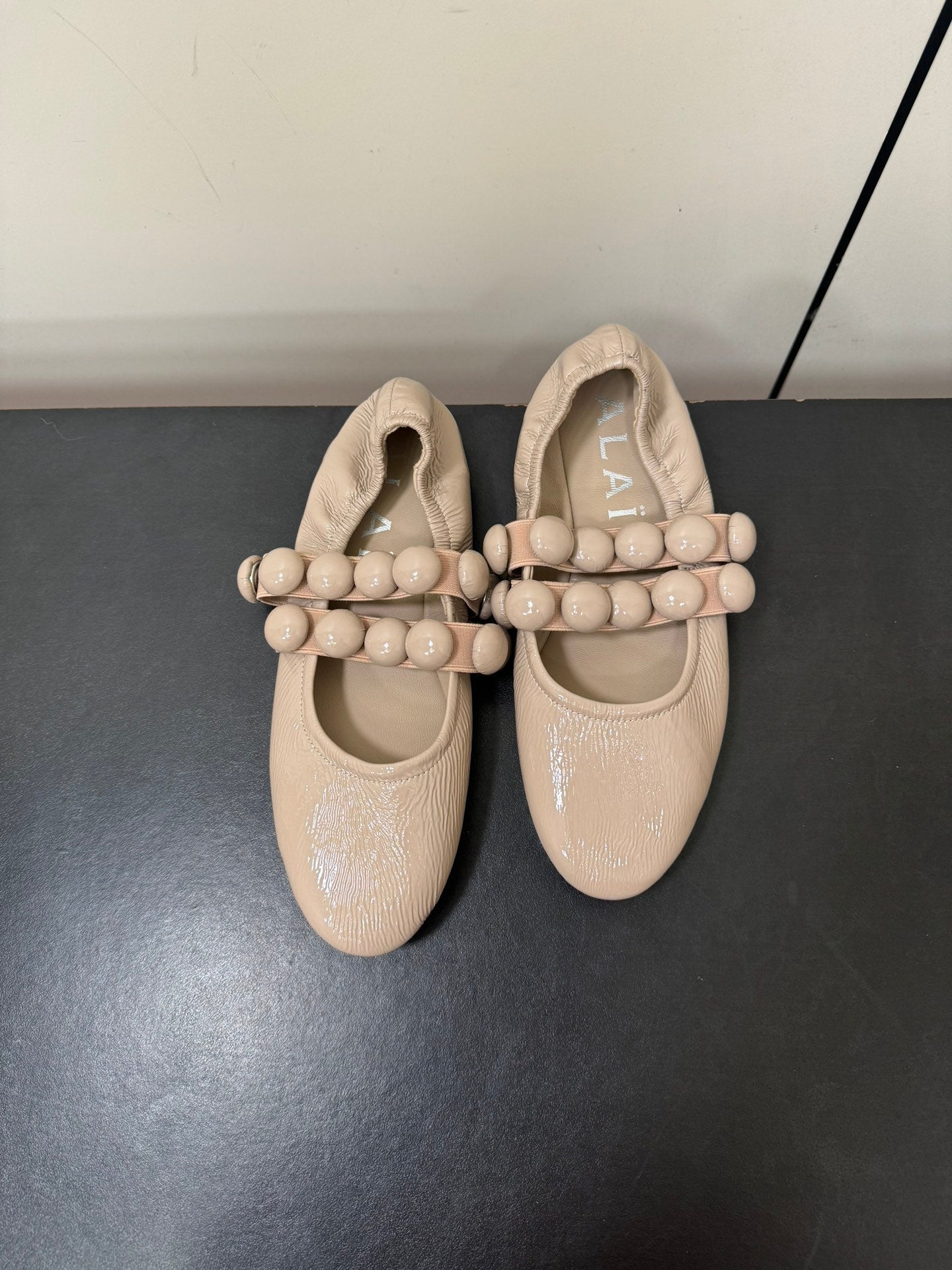 ALAIA SPHERE BALLET FLATS IN ALMOND BEIGE LAMBSKIN