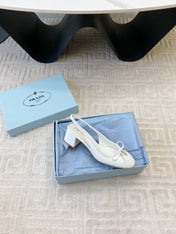 TRIANGLE LOGO SLINGBACK PUMPS WITH BOW IN WHITE CALFSKIN