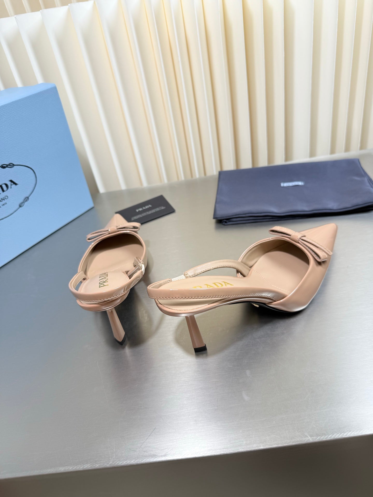 PRADA 26S POINTED-TOE SLINGBACK PUMPS IN BEIGE PATENT CALFSKIN WITH BOW