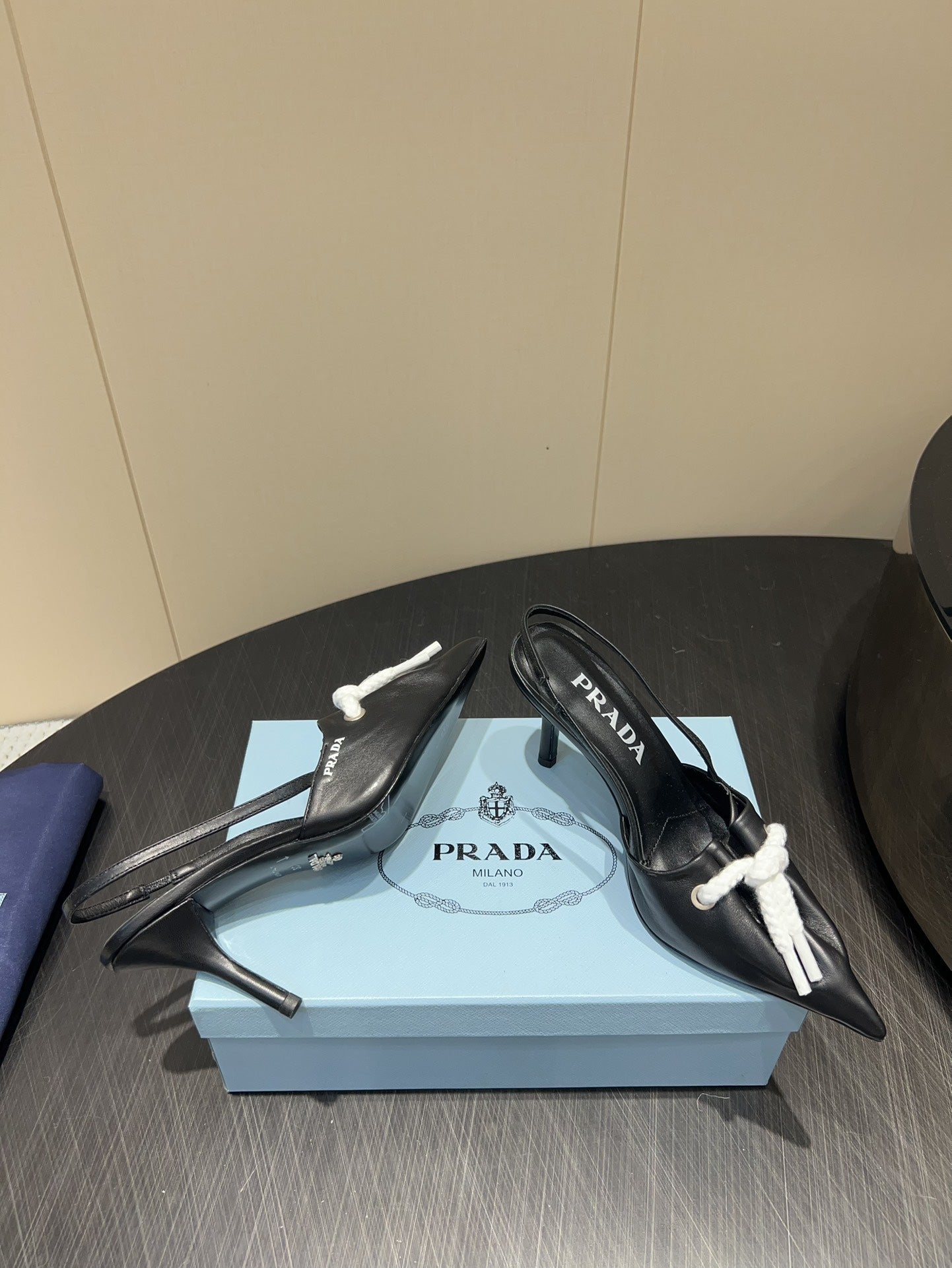 PRADA 25S POINTED TOE SLINGBACK 85MM IN BLACK LAMBSKIN WITH TIE UP DESIGN