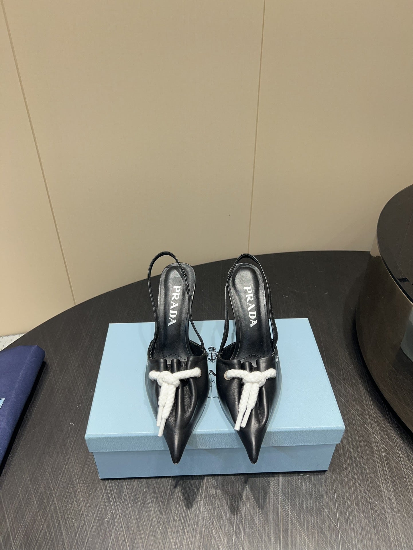 PRADA 25S POINTED TOE SLINGBACK 85MM IN BLACK LAMBSKIN WITH TIE UP DESIGN