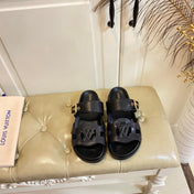 LV 26S ISOLA COMFORT MULES IN BLACK CALFSKIN