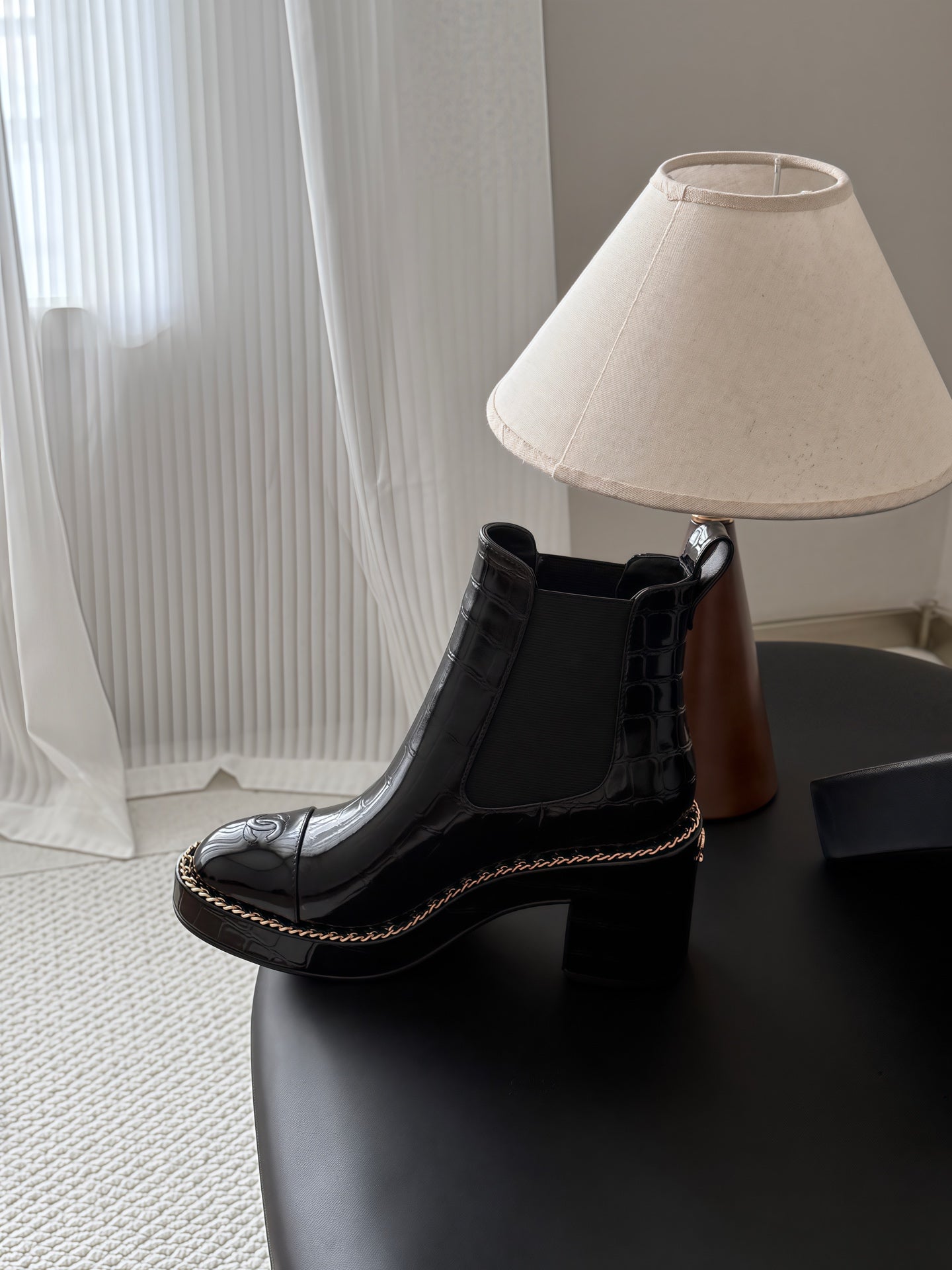 CHANEL 26S CHELSEA ANKLE BOOTS 70 MM IN BLACK EMBOSSED AND PATENT
