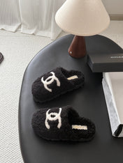 CHANEL 26S SLIDE SANDALS IN BLACK SHEARLING UPPER AND LINING WITH WHITE CC LOGO