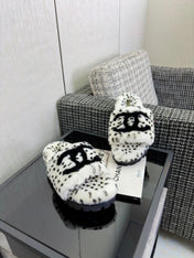 CHANEL 26S PLATFORM SLIDE SANDALS IN WHITE AND BLACK SHEARLING DALMATIAN PRINT