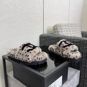 CHANEL 26S PLATFORM SLIDE SANDALS IN GRAY AND BLACK SHEARLING DALMATIAN PRINT