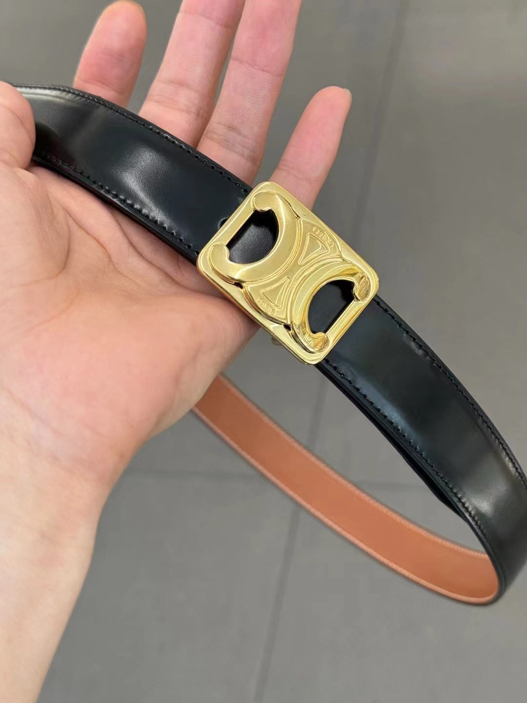 CL MEDIUM 25 MM REVERSIBLE FRAMED TRIOMPHE BELT BLACK AND BRONZE BROWN CALFSKIN GOLD HARDWARE